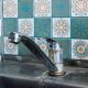 Old rusty sink faucet in kitchen. Rust streaks, calcium scale, hard water. Concept of poor water quality.